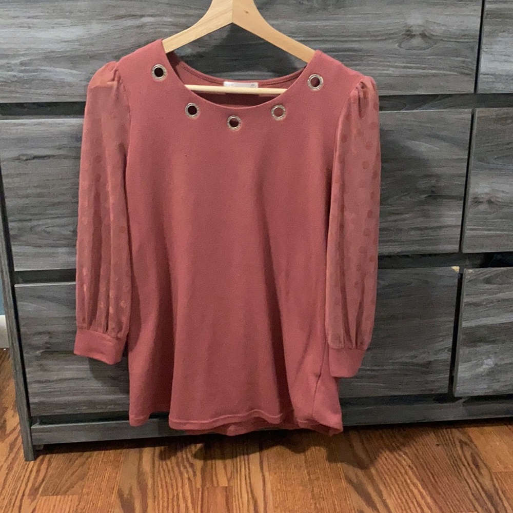 Salmon colored shirt with mesh type sleeves